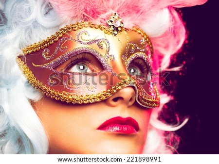 Woman wearing beautiful mask and old fashion wig