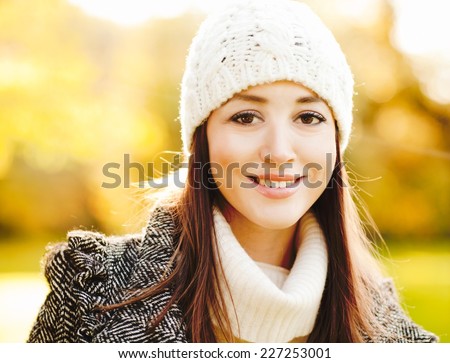 Beautiful girl smiling and enjoying winter sunshine