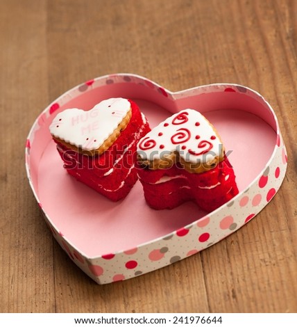 Cute heart shaped Valentine\'s cookies in a heart shaped box. I love you, you and me written on them.