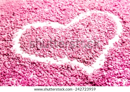 Heart shape in small pink rocky candies