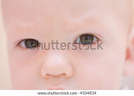 Serious baby face. Eyes close-up