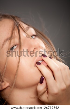Attractive light brown hair girl cover your mouth by hand. Over black