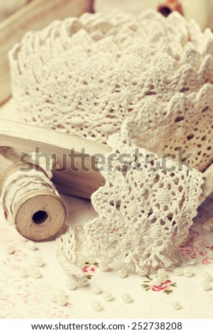 lace ribbon, old spools of thread in vintage style