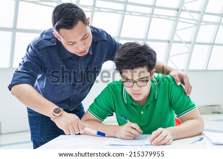 Men tutor try to teach student-Education concept