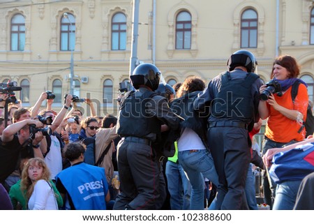 MOSCOW  MAY 7: Riot police are arresting an opposition activist giving a speech during a protest against president PutinÃ¢Â?Â?s inauguration on May 7, 2012 in Moscow, Russia.