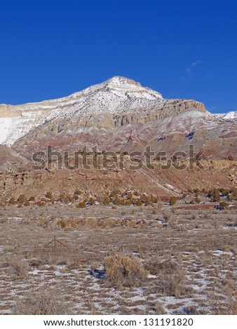 Light winter snow on eroded mountains  near Grand Junction, Colorado