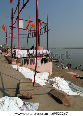 VARANASI, INDIA - NOV 7 - Dhobiwallah washes clothes in the Ganges River on Nov 7, 2009, in Varanasi, India.