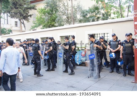 ISTANBUL - MAY 18, 2014 - Police in riot gear await orders during a protest demonstration near Taksim Square  in Istanbul, Turkey