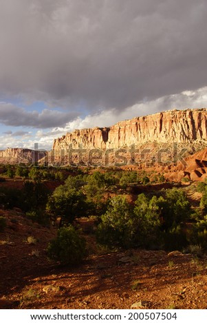 Golden Throne with dramatic backlighting for sedimentary rock of red Navajo sandstone,Capitol Reef National Park, Utah
