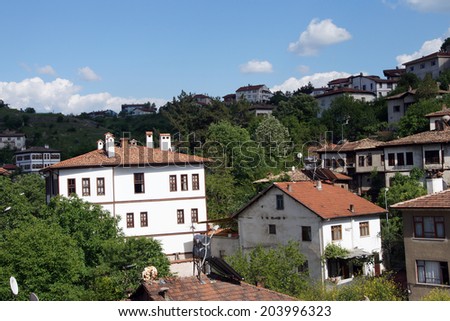 Old style Turkish konak country houses on a tree covered hillside  in  Safranbolu, Turkey
