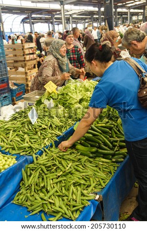 CANAKKALE, TURKEY - MAY 23, 2014 - Local shoppers buy vegetables at the weekly market  in Canakkale,  Turkey