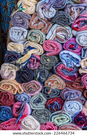 Rolls of fabric displayed in shop window, Sultanahmet area of Istanbul, Turkey
