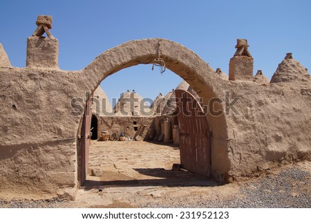 Traditional beehive mud brick houses and entry arch, Harran near the Syrian border, Turkey
