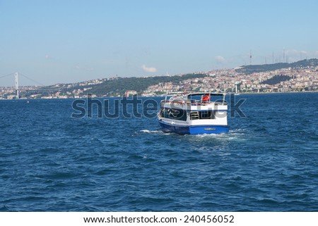 ISTANBUL, TURKEY  - MAY 18, 2014 - Passenger ferry carries tourists and commuters across the Bosphorus between European and Asian parts of Istanbul in Istanbul, Turkey