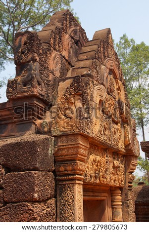 Intricate stone carving on red sandstone doorways and portals,  Banteay Srei, Cambodia