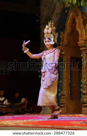 SIEM REAP, CAMBODIA - FEB 14, 2015 - Solo Apsara dancer uses hand gestures to tell a story,  Siem Reap,  Cambodia