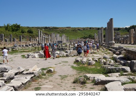 PERGE, TURKEY - JUN 2, 2014 - Guides dressed as Roman soldiers show tourists the ruins  in the ancient  city of Perge,  Turkey