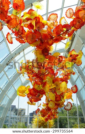 SEATTLE - JUL 23, 2015 - Glass flowers with sunlight in the conservatory, Chihuly Garden and Glass Museum,  Seattle, Washington