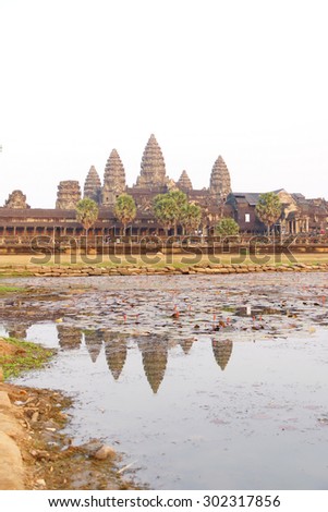 Sunset, central gopura towers and reflecting pool, Angkor Wat, Cambodia