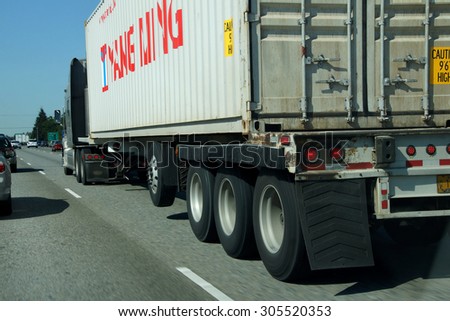 TACOMA, WASHINGTON - MAY 8, 2015 - Truck moves with traffic on the freeway  near Tacoma, Washington
