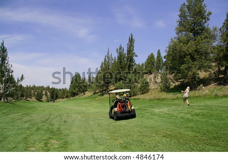 Lady golfer hitting ball from tee,		Eagle Crest Resort Golf Course,	Central Oregon