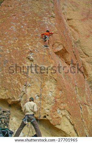 Climber on overhanging cliff route,  Smith Rock State Park,  Central Oregon