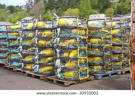 Yellow and blue crab floats, and crab traps, drying on wharf,  Newport, Oregon Coast