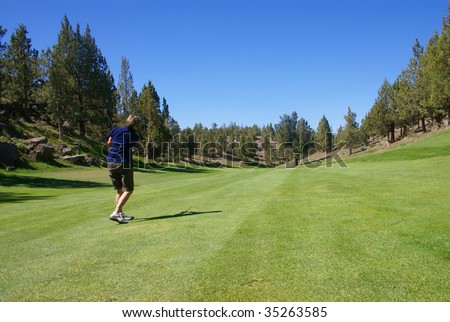 Woman golfer hitting from the fairway,		Eagle Crest Resort Golf Course,	Central Oregon
