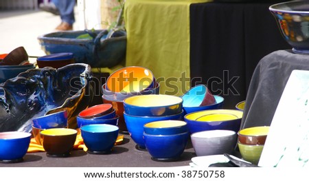 Brightly glazed bowls on display at crafts fair,   Street Fair, Pacific Northwest