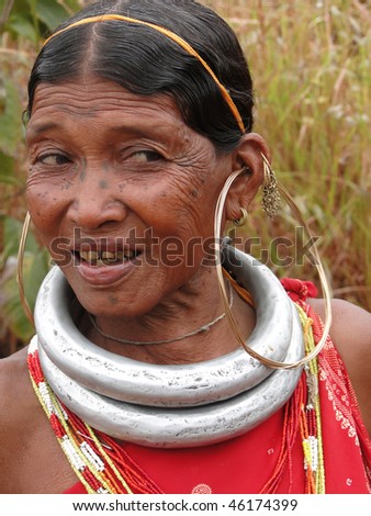 ORISSA,  INDIA - NOV. 12 : Bonda tribal woman poses for a portrait on her way to the  weekly market on Nov 12, 2009 in Ankadeli, Orissa, India