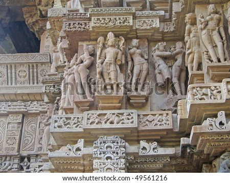 Sculptures of loving couples, illustrating the Kama Sutra, on walls of  Varaha Temple, Khajuraho in  India, Asia