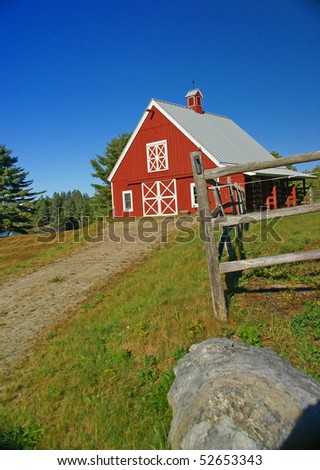 New England red barn and fence against blue sky.Mount Desert Island, Acadia National park, Maine, New England