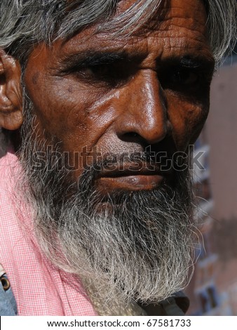 VARANASI, INDIA - NOV 7 - Old Indian man poses for his portrait in old city on Nov 7, 2009, in Varanasi, India.