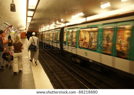 PARIS - OCT 3 - A Paris Metro train arrives in an underground station  on Oct 3, 2011, in Paris, France.