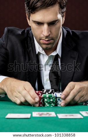Poker player, on a red background, going all in.