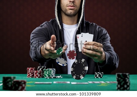 Poker player, on a red background, throwing poker chips.