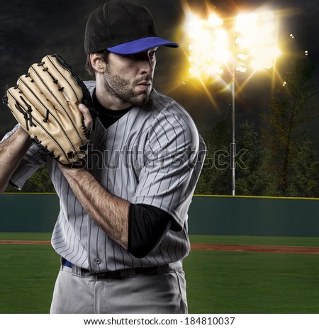 Baseball Player on a Blue Uniform on baseball Stadium.
