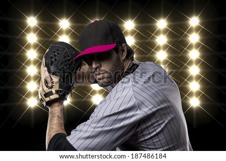 Baseball Player on a Pink Uniform on baseball Stadium.