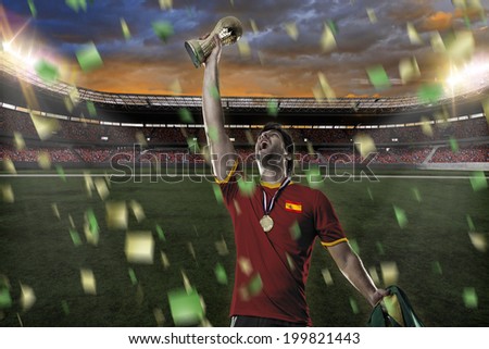 Spanish soccer player, celebrating the championship with a trophy in his hand. On a stadium.