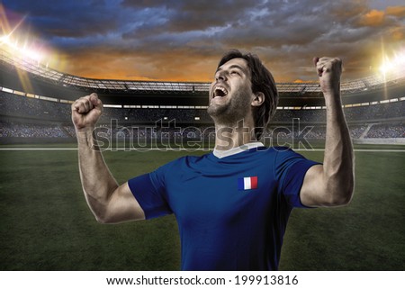 French soccer player, celebrating on a stadium.