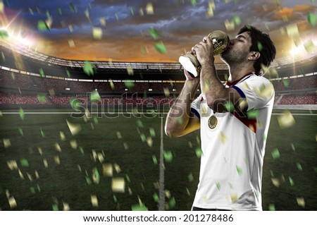 costa rican soccer player, celebrating the championship with a trophy in his hand. On a stadium.