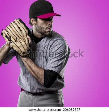 Baseball Player on a pink Uniform on pink background.