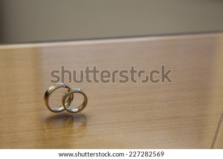wedding band on a wooden table.