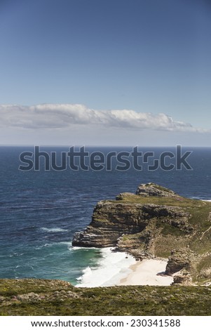 Cape of Good Hope, with a blue sky and some clouds.
