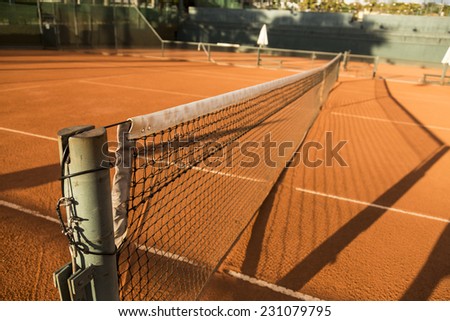 Clay (Dirt) Tennis Court, under the sunset.