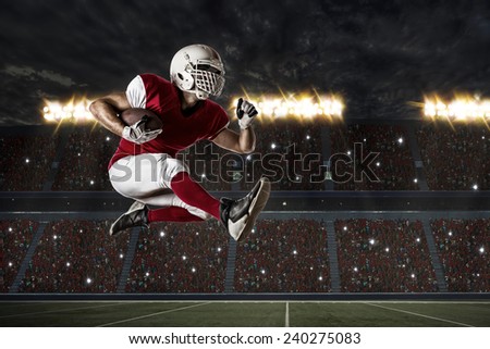 Football Player with a red uniform Running on a Stadium.