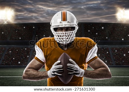 Football Player with a orange uniform on a stadium.