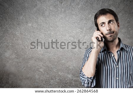 Portrait of expectant man while listen a call phone. Horizontal image.