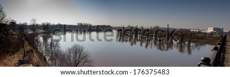Trees reflection on water, flooded during the spring flood. Panoramic landscape.