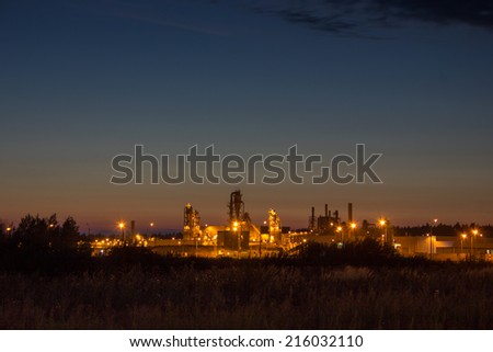 Night image of timber processing plant. Modern factory.